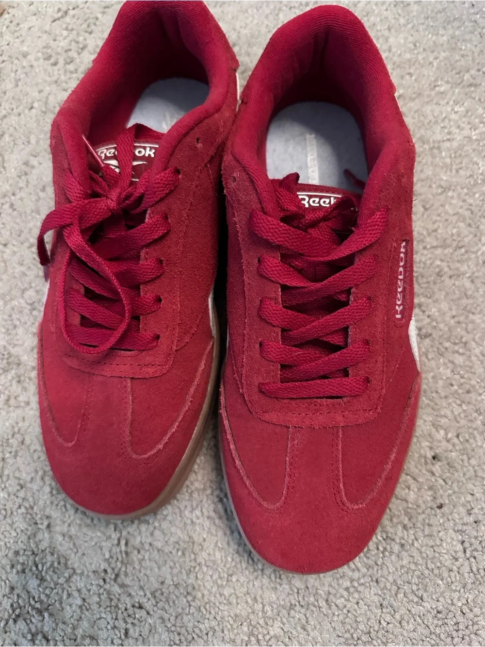Reebok women’s red Suede Low-Top Sneakers